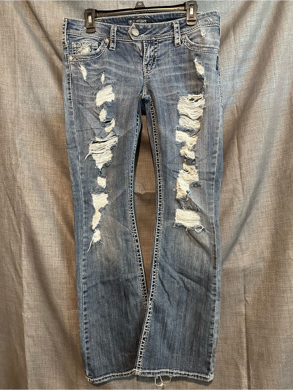 Silver Jeans Women's Distressed Light Blue Flare Jeans